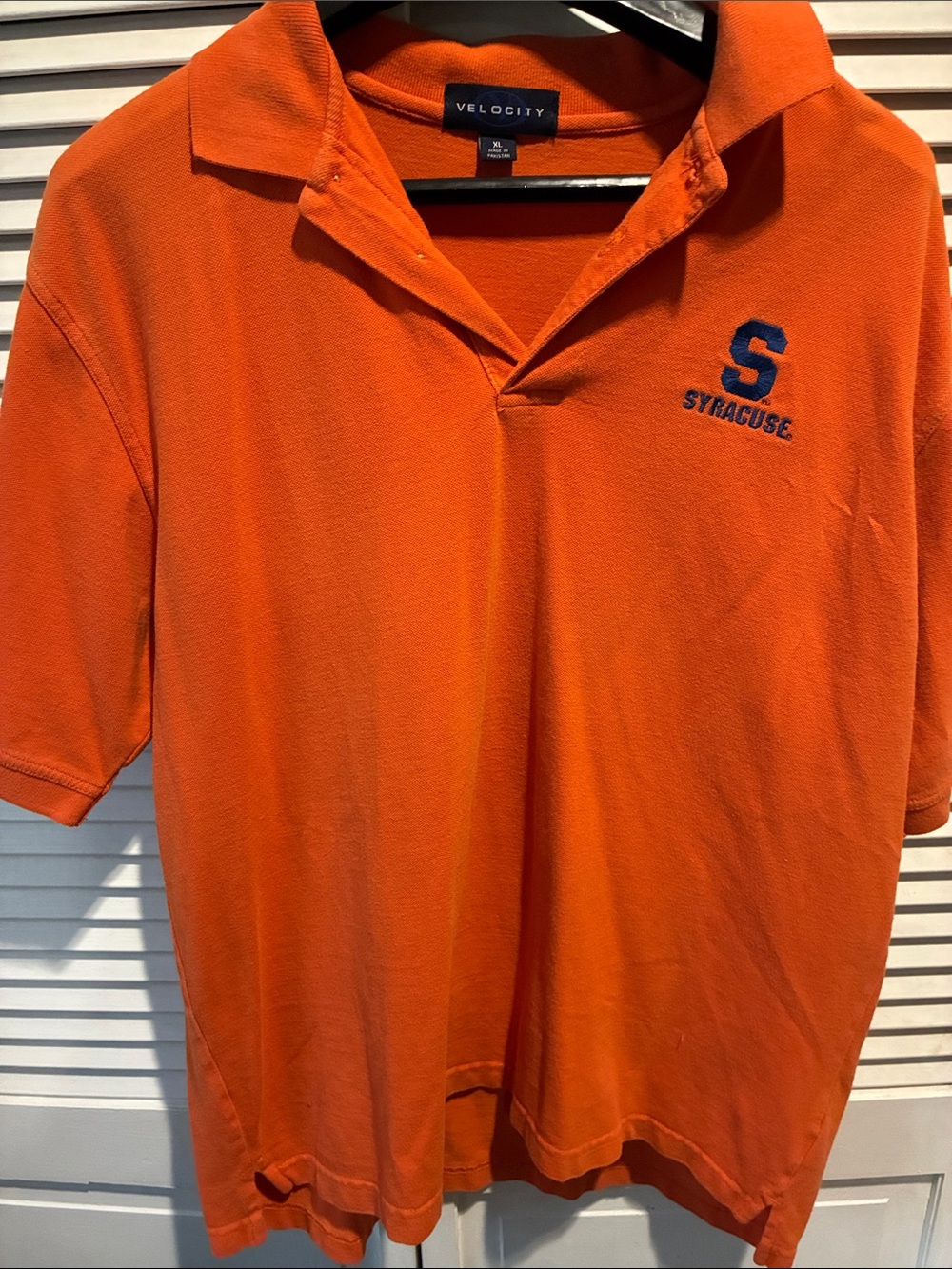 Velocity Orange Polo with Navy 'S' Embroidery